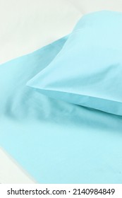 Corner Of A Soft Pillow In A New Colored Cotton Fiber Pillowcase. Satin  Material To Protect And Decorate The Pillow. Bed Linen For Home And Hotels