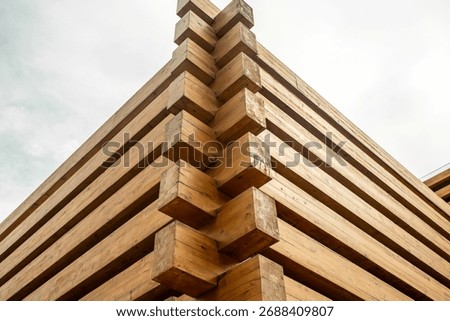Corner of strength, interlocking timber beams in modern architecture