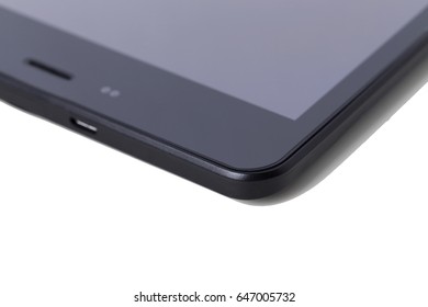 Corner of a tablet computer. Isolated on a white background.