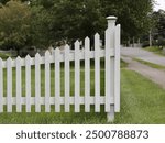 Corner of white picket fence