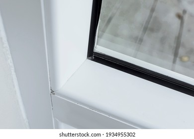 The Corner Of A Window Pvc Frame With A Rubber Gasket Or Seal.