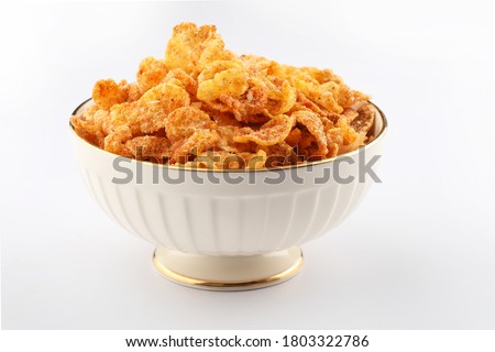 Cornflake Chivda or Corn Chiwda loaded with peanuts and Cashew. Served in a bowl. selective focus