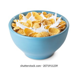cornflakes in blue bowl. Breakfast cereal with splashing milk isolated on white background - Shutterstock ID 2071911239