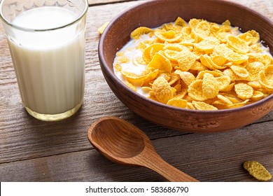 Cornflakes cereal and milk in a clay bowl. Morning breakfast. - Powered by Shutterstock