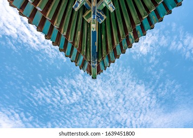 Cornice of Chinese classical architecture under blue sky and white clouds - Powered by Shutterstock
