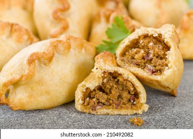 Cornish Pasty - Baked pasty filled with meat and potatoes. Cornwall's traditional dish. - Shutterstock ID 210492082
