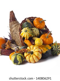 Cornucopia of vegetables isolated on white.