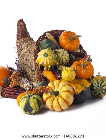 Cornucopia of vegetables isolated on white.