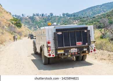 Corona, CA USA - June 15, 2019: Cleveland National Forest Near City Limits With Hiking Trails Recently Damaged By Forest Fires In The Mountains. Southern California Edison Trucks Checking Power Lines.