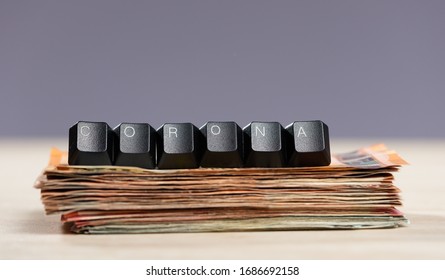 Corona Letters Stacked On Euro Banknotes