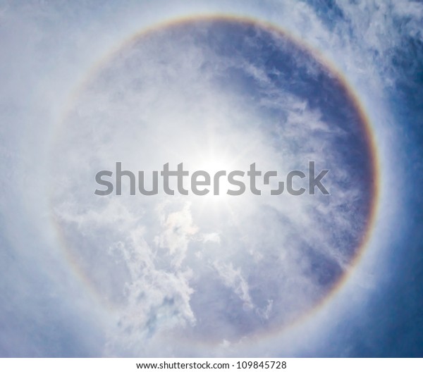 Corona on blue sky,\
the sun with the ring