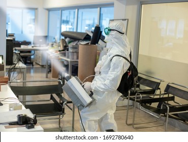 Corona spraying in office floor - Shutterstock ID 1692780640