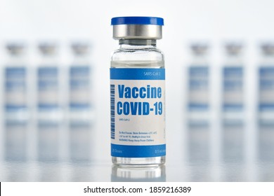 Corona Virus Covid 19 Vaccine Vial Bottle For Intramuscular Injections Isolated On Medical Pharmacy Industry Background. Coronavirus Cure Manufacture, Flu Treatment Drug Pharmacy Production Concept.