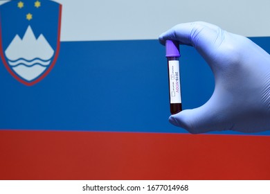 Corona Virus Or Covid-19 In Slovenia  , Sample Blood Tube In Hand With Slovenia  Flag On Background