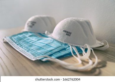 Corona virus prevetion face mask protection N95 masks and medical surgical masks at home . - Shutterstock ID 1662762004