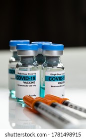 Corona virus vaccine, Covid-19 vaccine in Vial. White background and syringes.