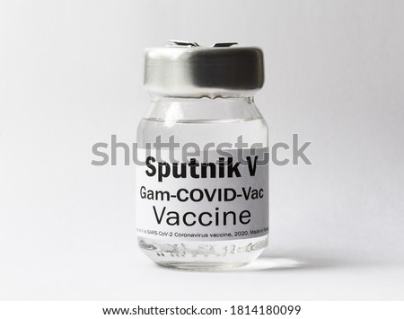 Corona virus vaccine Sputnik V on white background, bottle with Russian vaccine for SARS-CoV-2  coronavirus cure. Concept of medicine, Sputnik vac, treatment and research due to COVID-19 pandemic.