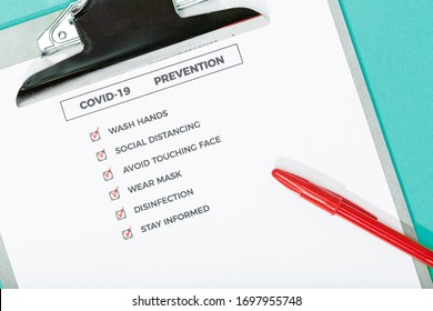 Coronavirus Advices Or Prevention Concept. Top View Of A COVID-19 Prevention Check List And Safety Equipment