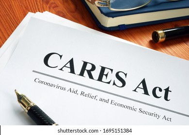 Coronavirus Aid, Relief, and Economic Security CARES Act on the desk. - Shutterstock ID 1695151384