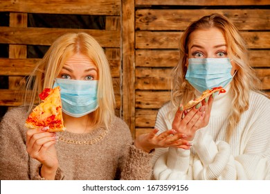 Coronavirus, air pollution pm2.5,  and quarantine concept. Stressed beautiful women cannot eat pizza at restaurant because they are in medicine respirator mask. 