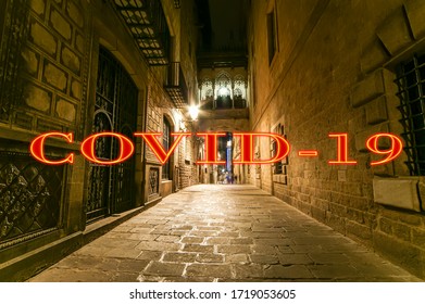 Coronavirus In Barcelona, Spain. Covid-19 Sign. Concept Of COVID Pandemic And Travel In Europe. Gothic Quarter At Night. Empty Alleyways 