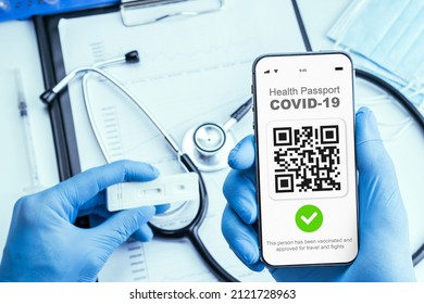 Coronavirus Certificate. Medical Equipment With Covid Immunity Passport Or Vaccine Certificate On Phone Screen, Doctor Charts And Stethoscope On Hospital Background. Health And Surveillance Concepts.