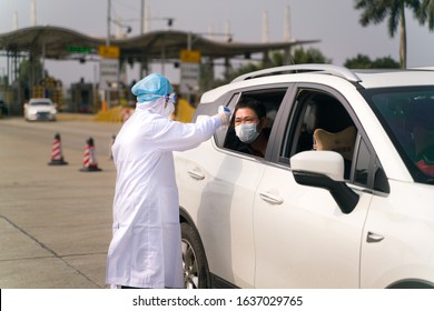 The Coronavirus Check Post On Highway. Doctors Checking Temperature.