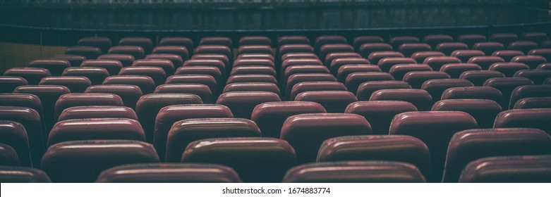 Coronavirus Closure Of Public Spaces Such As Cinemas, Theatres, City Lockdown. Retail Businesses Shut Down. Banner Panoramic Background Of Empty Concert Seats.