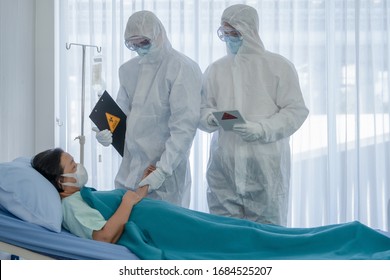 Coronavirus Covid 19 Treatment Background Of Coronavirus Covid 19 Patient On Bed With Doctors In PPE Coverall Suit In Hospital Negative Pressure Quarantine Room, Coronavirus Covid 19 Disease Treatment
