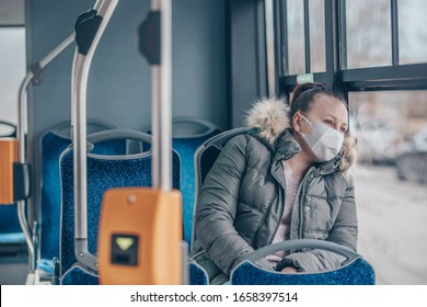 Coronavirus Covid 2019 Woman With Respiratory Mask Traveling In The Public Transport By Bus, Transportation Cocnept