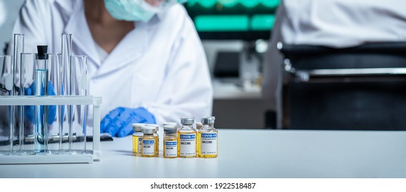 The Coronavirus Or COVID Vaccine Researched By Pharmaceutical Bio Research And Development Scientist Team. The Researcher Work In Laboratory Room Of Covid-19 Vaccine And Drug Manufacturing Company.