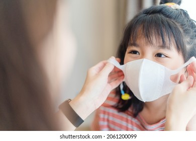 Coronavirus Covid-19 Asian Mother Wearing Mask For Kid Teen Girl Before Go To Take Vaccine.Back To School.school And Infected Disease.Travel Vacation Safe.School Kid.Pediatric, Covid19 Insurance.