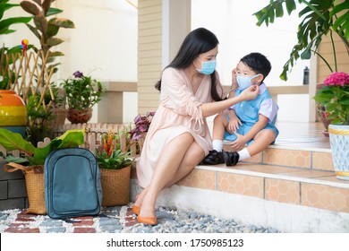 Coronavirus Covid-19 Concept.Asian Boy With Mother Wearing N95 Mask For Protect From Coronavirus For Back To School. School Kid Go To School With Mom.New Normal Lifestyle Post Coronavirus.