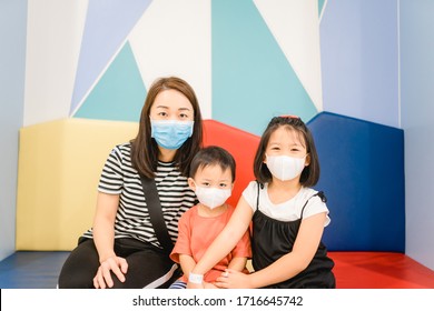 Coronavirus Covid-19 Concept.Little Chinese Boy And Girl Sibling And Mother Wearing Face Mask In Hospital For Health Check Up Her Son.Illness Asian Baby Toddler Boy Go To Pediatric Ward.medical Heath 