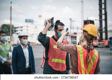 Coronavirus Covid-19 Disease Epidemic Crisis Situation, Construction Worker Having Fever Body Scan By Thermometer Scanning At Construction Site. Corona-Virus Covid19 Prevention Of New Normal Concept