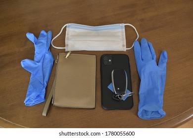 Coronavirus And COVID-19 Essentials. Gloves, Mask, Phone, Wallet, And Keys.