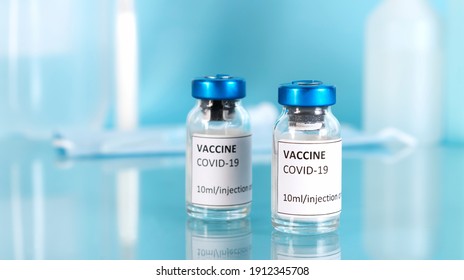 Coronavirus covid-19 vaccine against the pandemic. Vaccination with vaccine vials. Laboratory background. Horizontal orientation.  - Shutterstock ID 1912345708