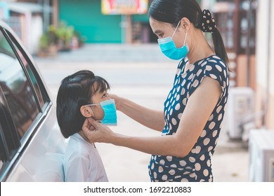 Coronavirus Covid-19 Virus Protection Family Concept, Mother Wearing Mask To Kids Protect Coronavirus Covid-19 In Air Before Go Out Of Home, Safety Children From Disease To Sick And Ill, Asain People