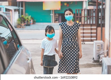 Coronavirus Covid-19 Virus Protection Family Concept, Mother And Kids Protect Coronavirus Covid-19 By Wearing Mask And Working In The Home, Children Rise Hand Show Stop Go Out Of Home, Asian People