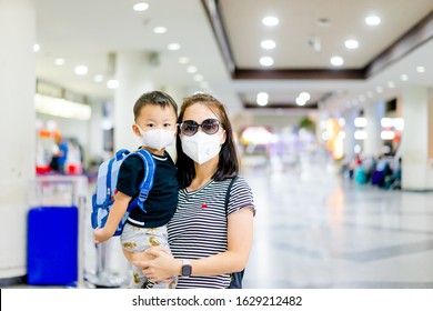 Coronavirus Covid-19.Asian Tourism Kid Toddler Boy With Mother Mask For Protect Coronavirus Back To School.vaccinated Family At Airport.Digital Health Passport Certificate For Travel During Covid19.