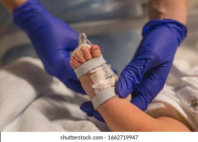 Coronavirus. Covid-19.Doctor checking newborn baby. Vaccination virus. midwife giving antibiotics to newborn baby. Small baby having antibodies check. Newborn baby in hospital. Pandemic virus. Sepsis