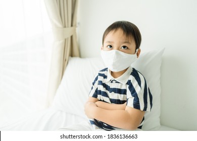 Coronavirus Covid-19.Healthcare Medical.Little Asian Boy Wearing Face Mask At Home.Toddler Stubborn Child.Punish Child At Home.Covid-19 Coronavirus.Stay Home.Lonely Kid, Sick And Illness.Mental Health