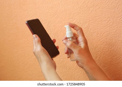 Coronavirus Desinfection. Wiping With Antibacterial Wipe. Clean Mobile Phone During Corona Virus Pandemic Quarantine. Covid 19 Concept.