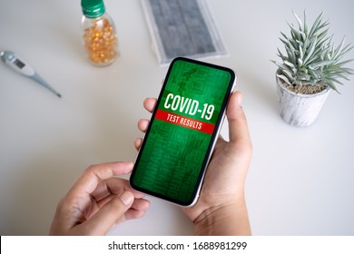 Coronavirus Disease 2019 Or Covid-19 Test Results Online Application Background Concept. Mockup Mobile Phone, A Person Holding Smartphone For COVID19.