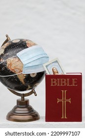 Coronavirus Epidemic (covid-19). Global Pandemic. Bible And World Map With Surgical Mask. 