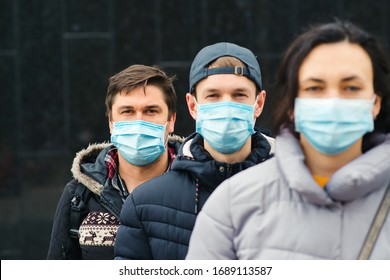 Coronavirus Epidemic. People Wearing Face Mask Outdoors. Group Of Young Volunteers. Coronavirus Quarantine. Global Pandemic. Worldwide Coronavirus Outbreak.