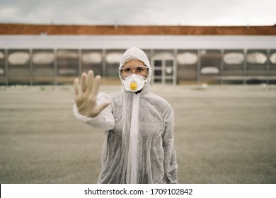 Coronavirus ER Doctor In Front Of Isolation Ward Hospital.Covid-19 Physician With Protective Gear.Hand Stop Sign.Stop Coronavirus.Quarantined Area.No Entrance Allowed