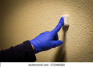 Coronavirus Food Supplies. Delivery Man In Medical Rubber Gloves. Quarantine. Coronavirus. Ring The Doorbell With Disposable Gloves To Prevent The Spread Of Coronavirus.