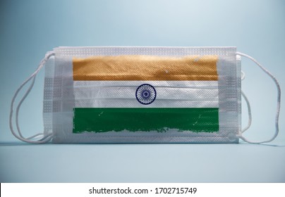 Coronavirus in India Concept.Dramatic atmosphere Indian Flag printed on surgical protective mask.Impact of pandemic virus on indian economy.Covid -19 spread around india and rest of world.covid-19 - Powered by Shutterstock