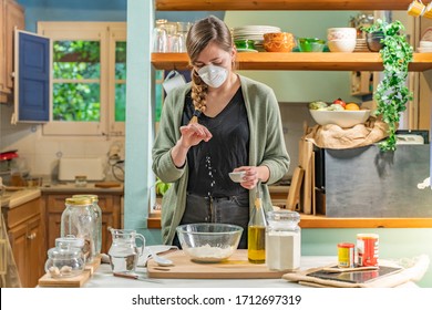 Coronavirus. Isolated Pretty Woman With Face Mask On Quarantine, Cooks In The Kitchen At Home During Coronavirus Crisis. Stay At Home. Enjoy Cooking At Home. Family Concept.
Beautiful Rustic Kitchen.